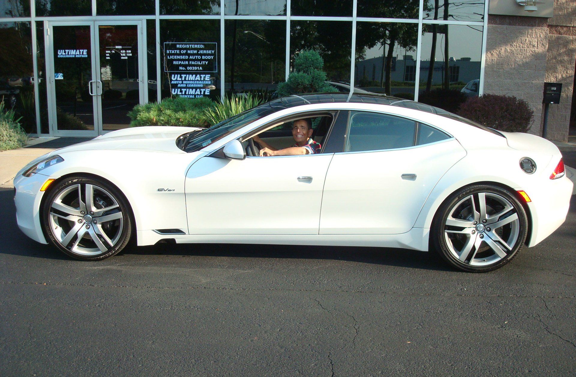 Paul with a solar-powered Fisker Karma