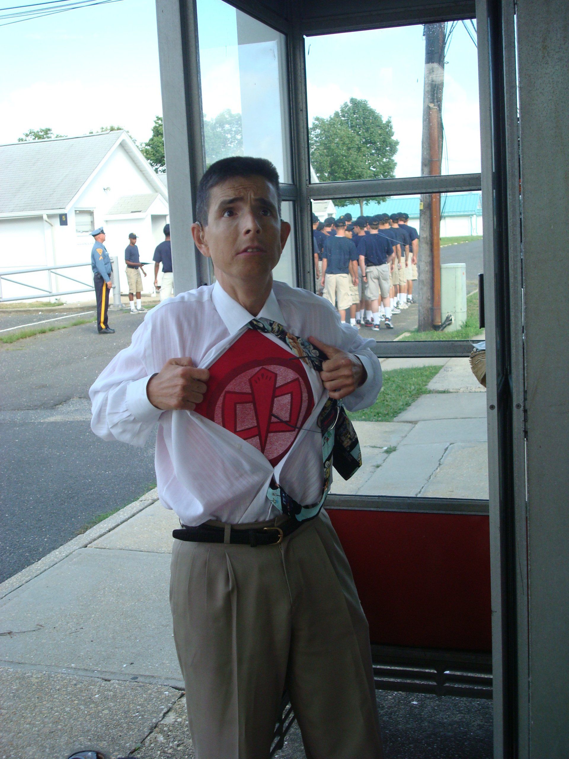 Having fun outside a phone booth!