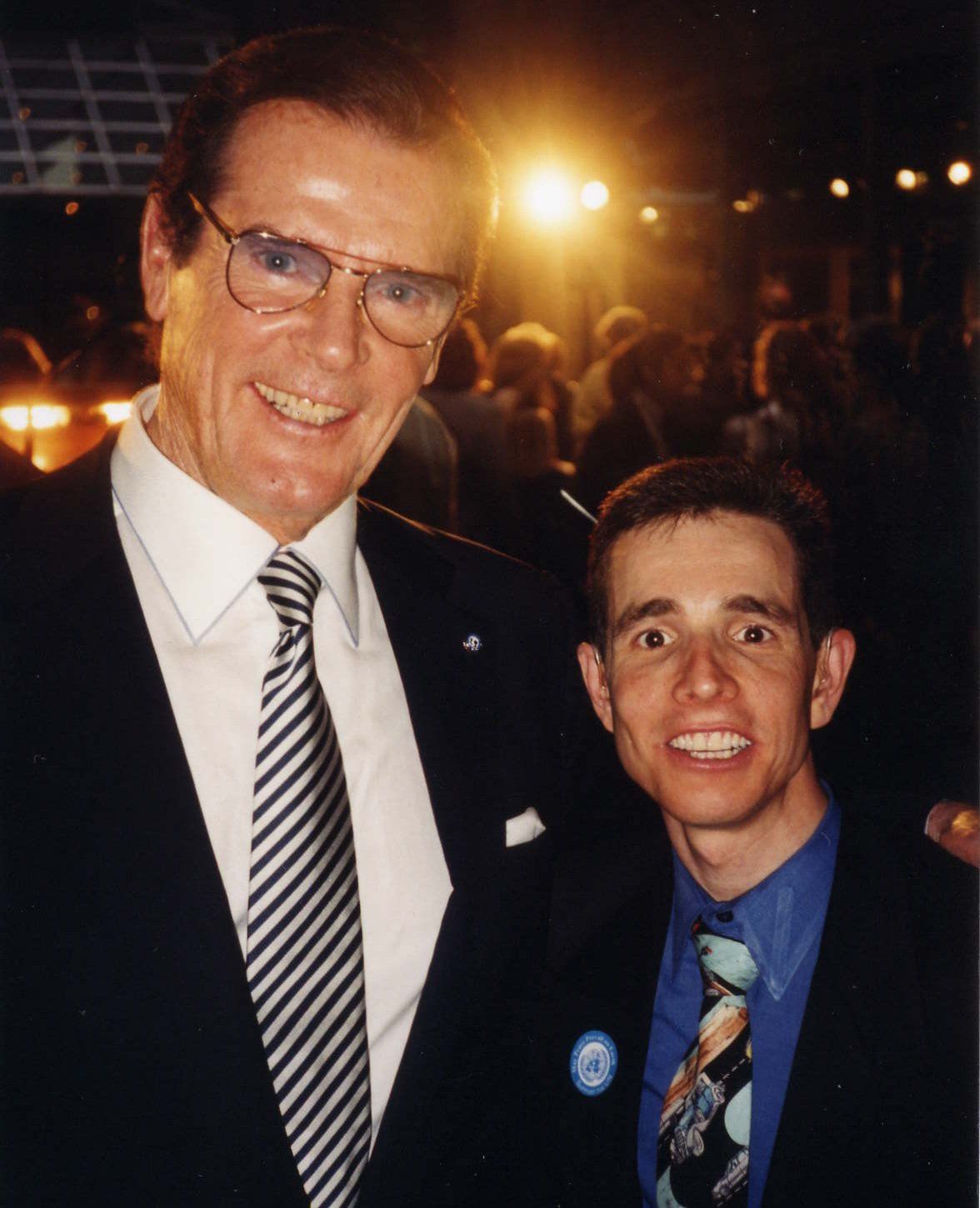 With actor Sir Roger Moore (James Bond).