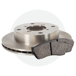 A close up of a brake disc and pads on a white background