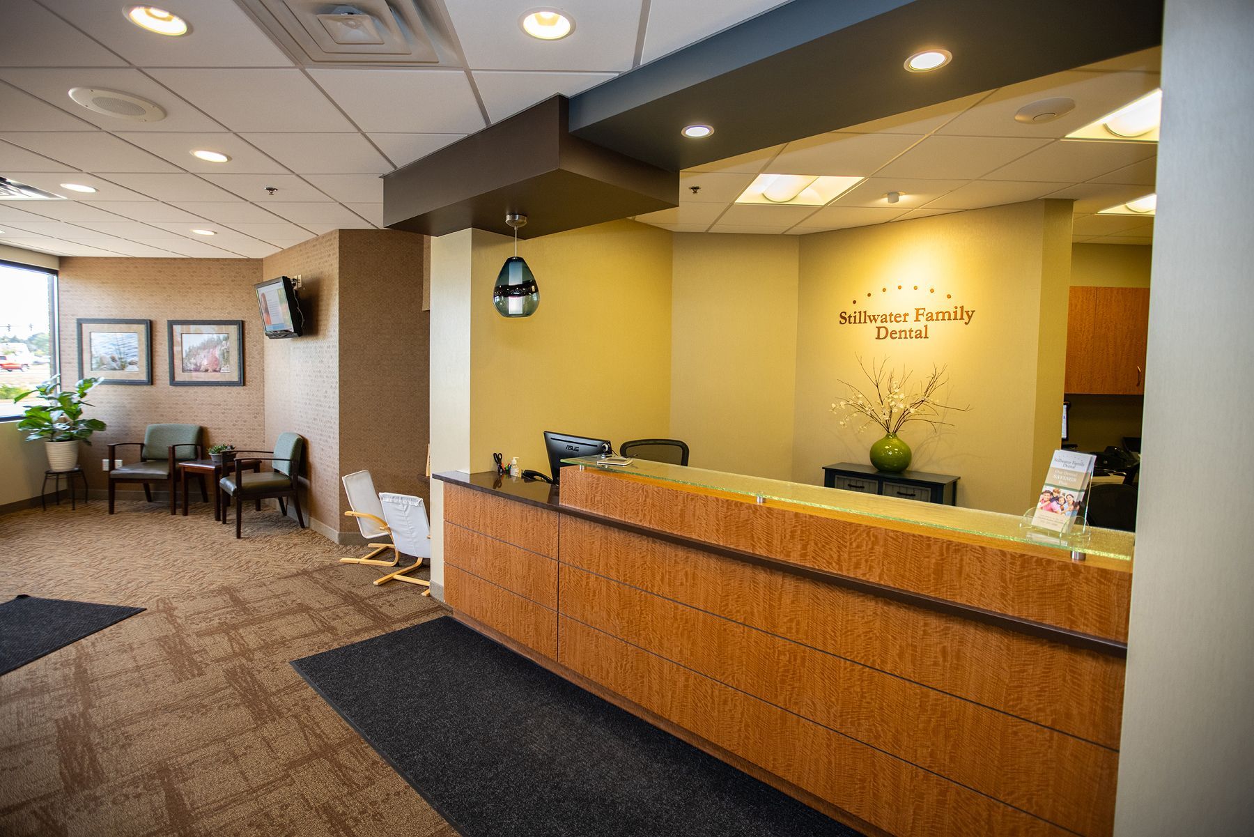 A group of women are posing for a picture at stillwater family dental