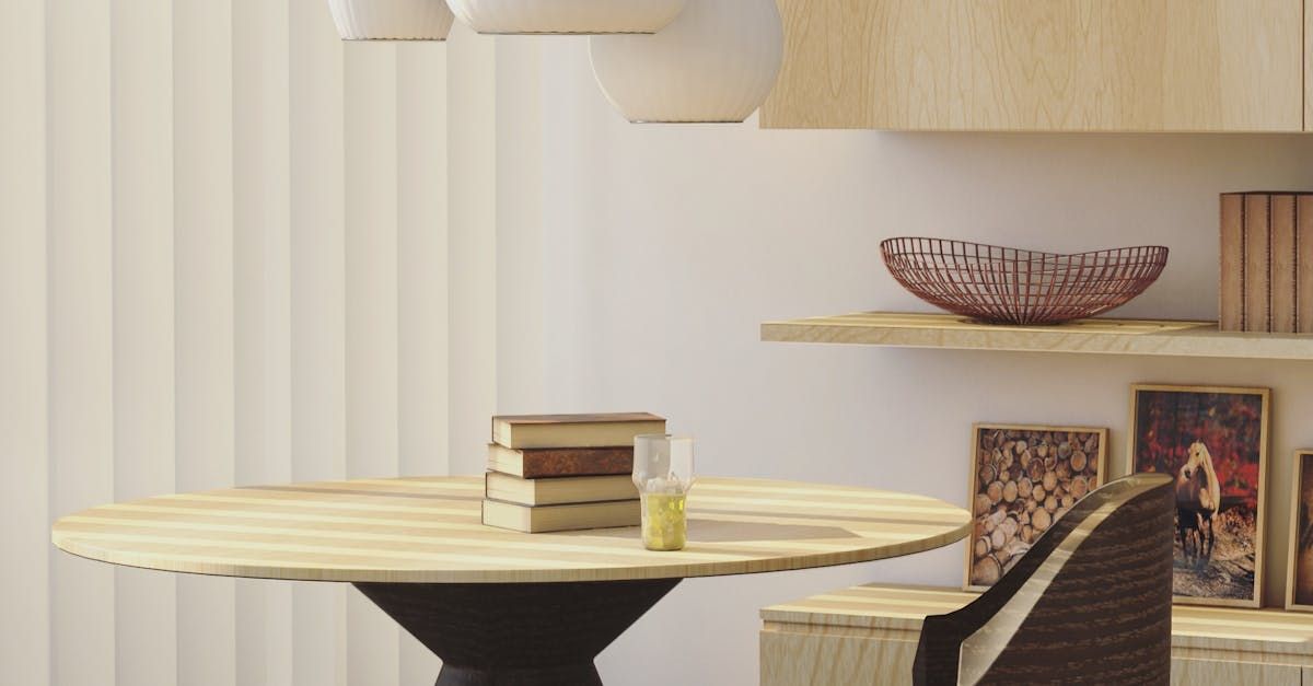 A wooden table and chair in a living room with a bowl on the shelf.