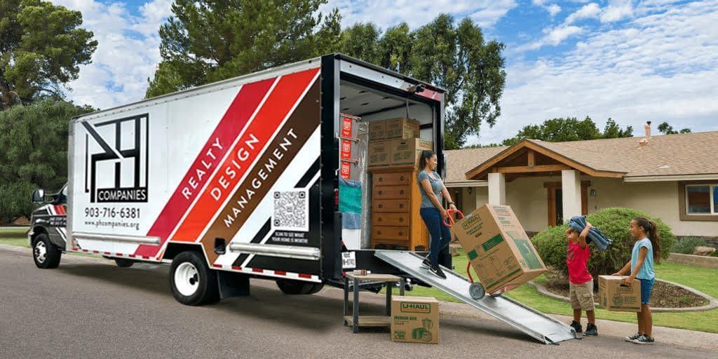 PH Companies Moving Truck parked in front of a house | PH Realty, your best partner with Texarkana, TX Real Estate