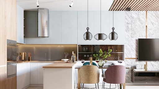 A kitchen with a dining table and chairs and a television.