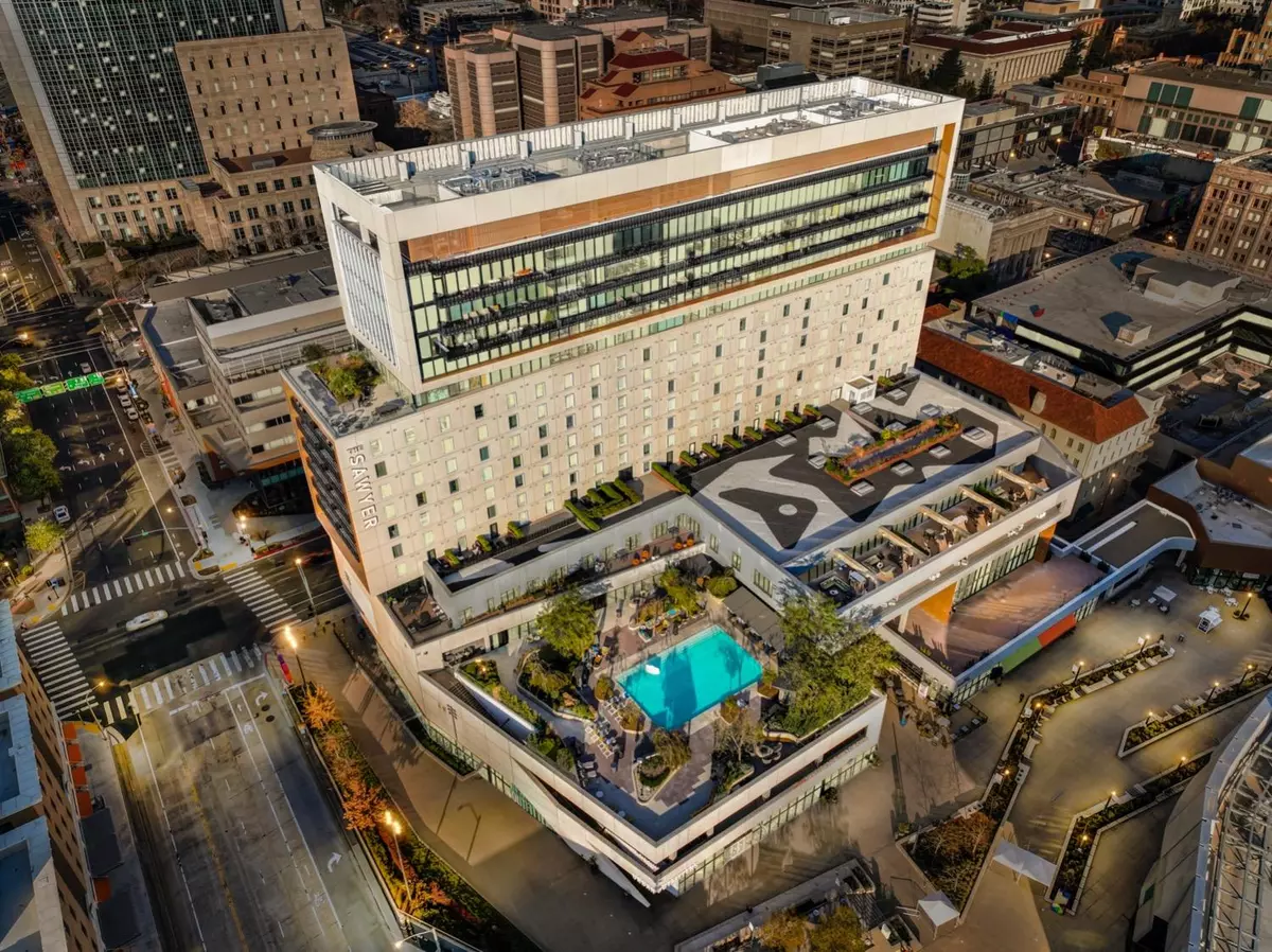 An aerial view of a large building with a rooftop pool. Search Homes for Sale in Texarkana, TX with PH Realty