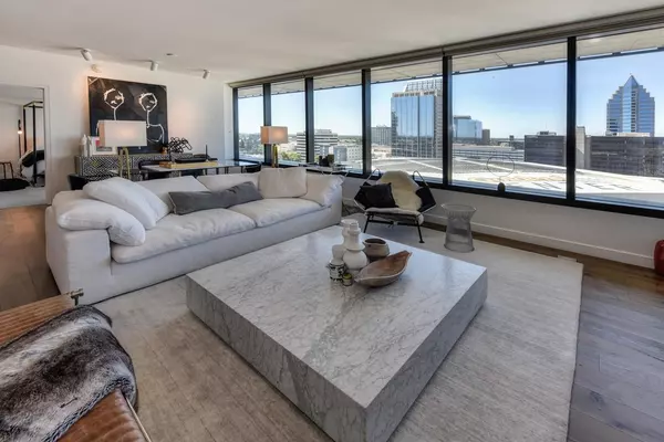 Living Room with big windows and a beautiful coffee table. Explore properties in Texarkana, TX Real Estate with PH Realty