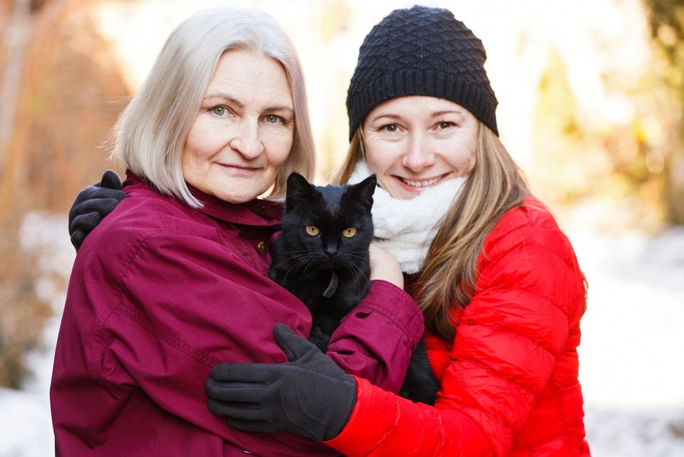 Happy Women and Black Cat — Hayward, CA — Alta Vista Veterinary Clinic