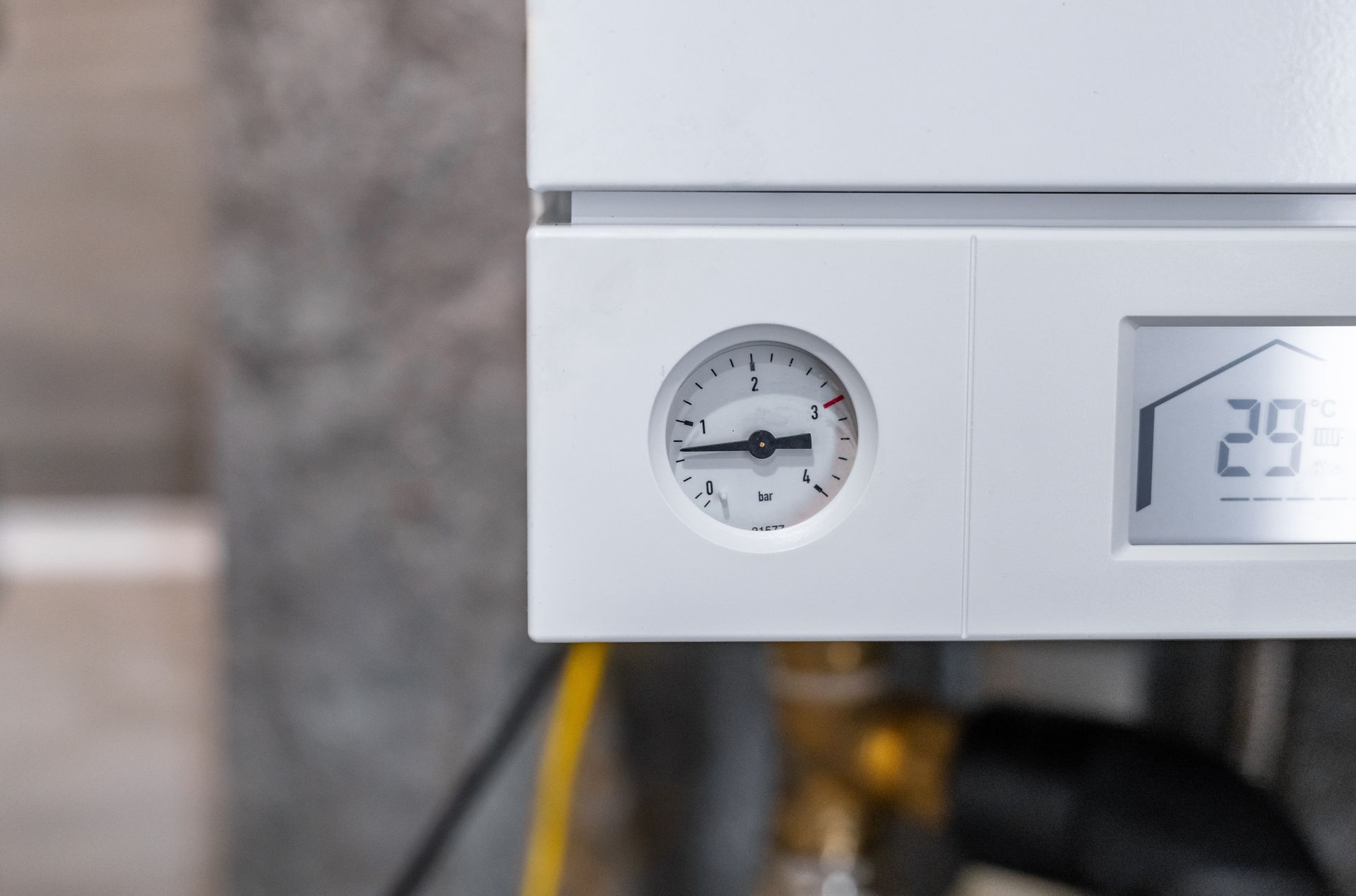 White boiler with pressure gauge and digital display showing temperature (29°C).