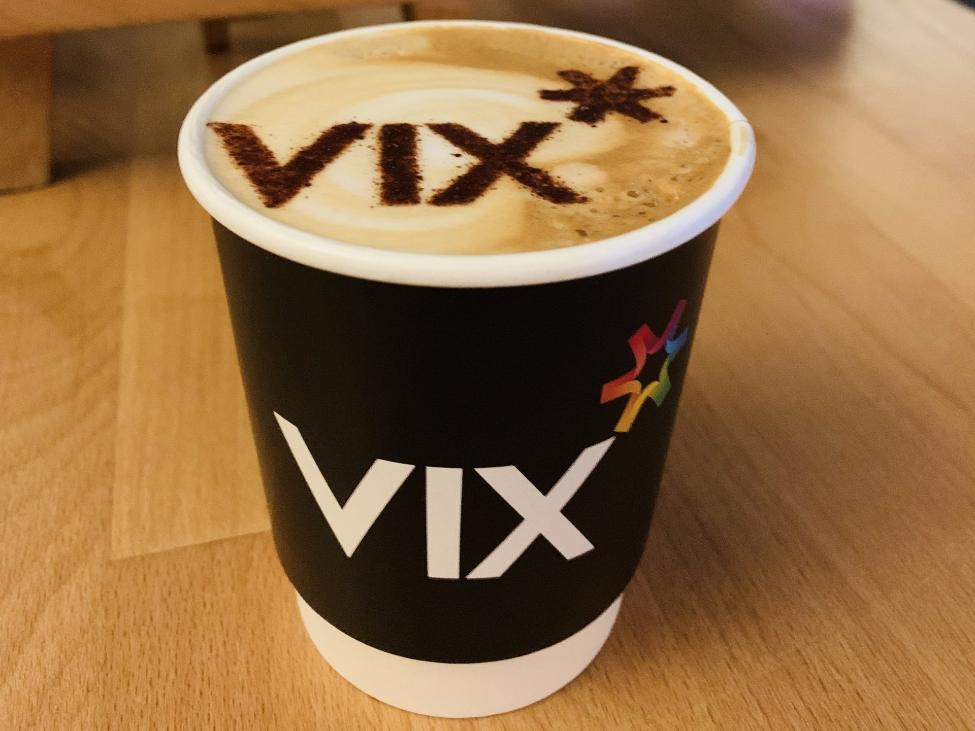 Branded coffee cup with logo stencil