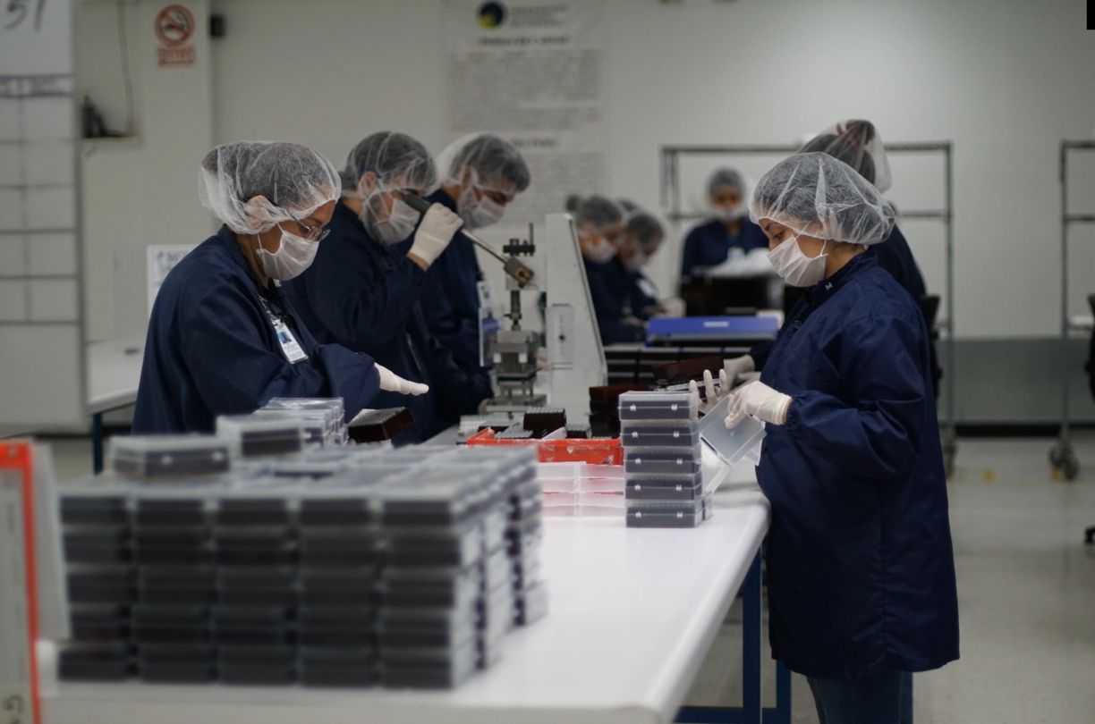 A group of people are working in a factory