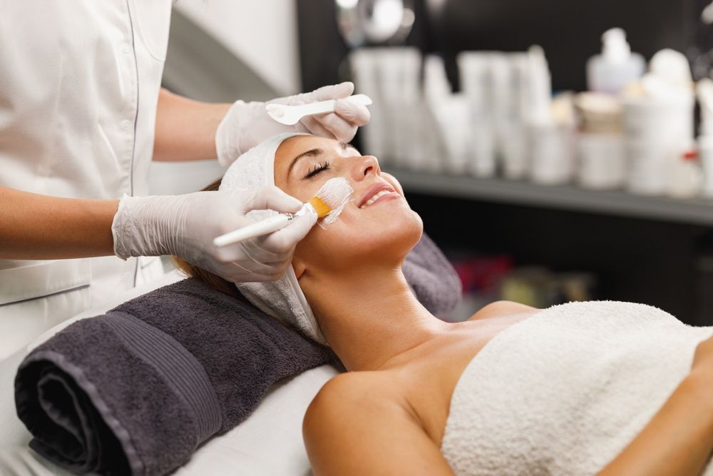 Woman is Getting a Facial Treatment at a Spa — Advanced Cosmetic & Beauty Clinic in Bundaberg South, QLD