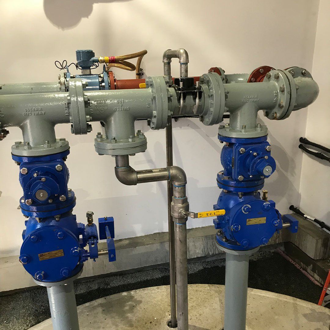 A bunch of pipes are connected to each other in a room