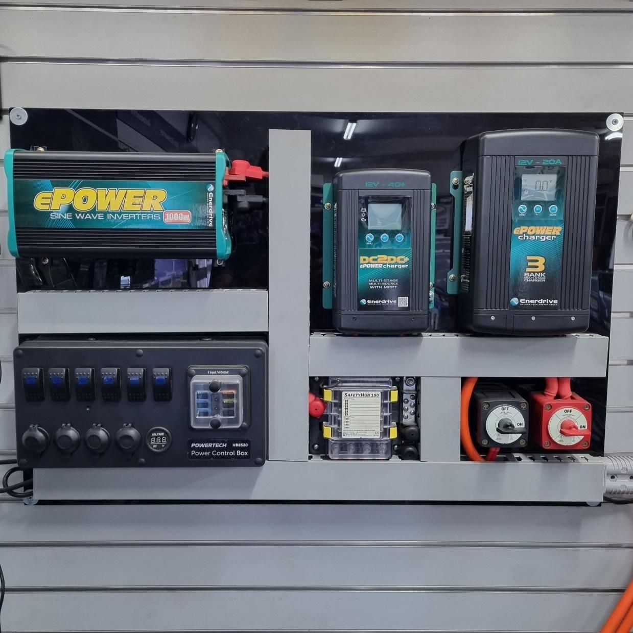 A Wall Filled With Electrical Equipment Including a ePower Inverter — Battery World Townsville In Garbutt, QLD