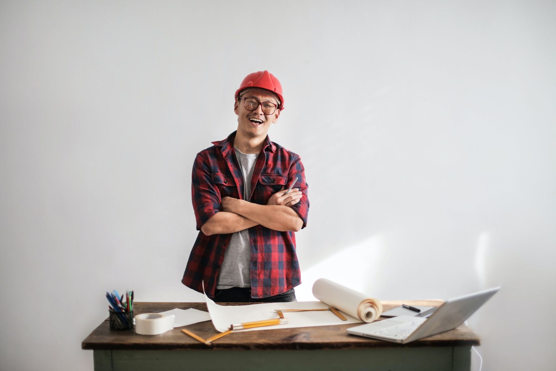 A guy standing in front of a table