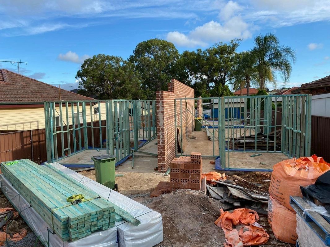 A construction site with a lot of wood and bricks