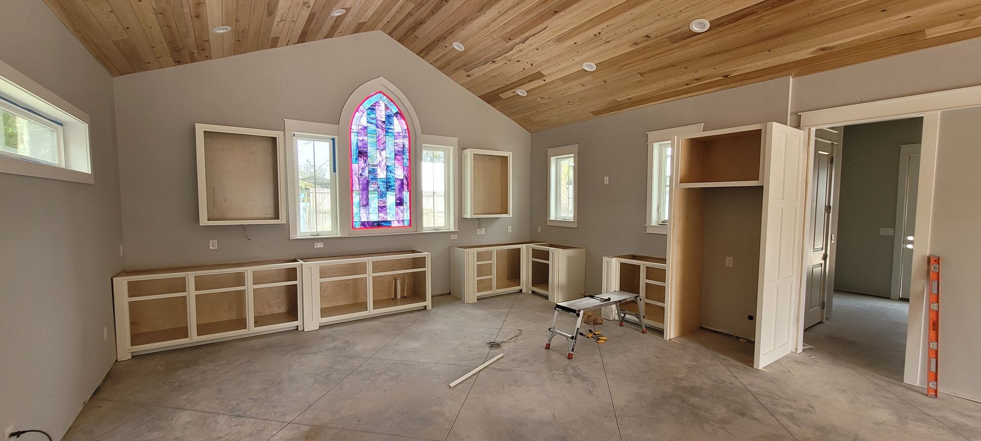 There is a stained glass window in the middle of the room.