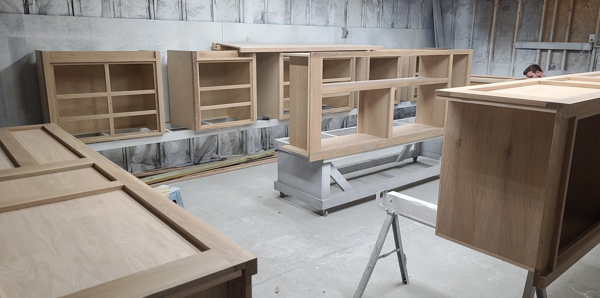 A room filled with lots of wooden boxes and shelves.