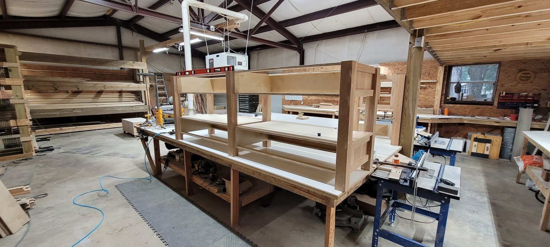 A warehouse filled with wooden shelves and tables.