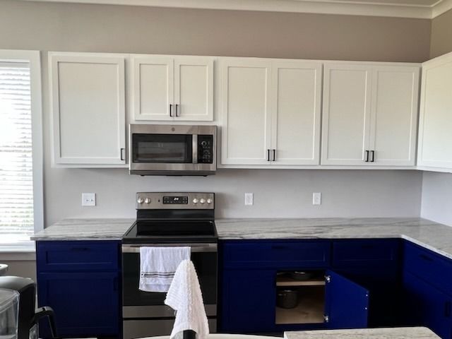 A room filled with lots of wooden cabinets being built.