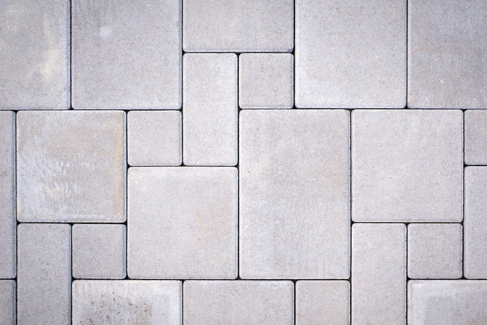 A close up of a brick pavement with a geometric pattern.