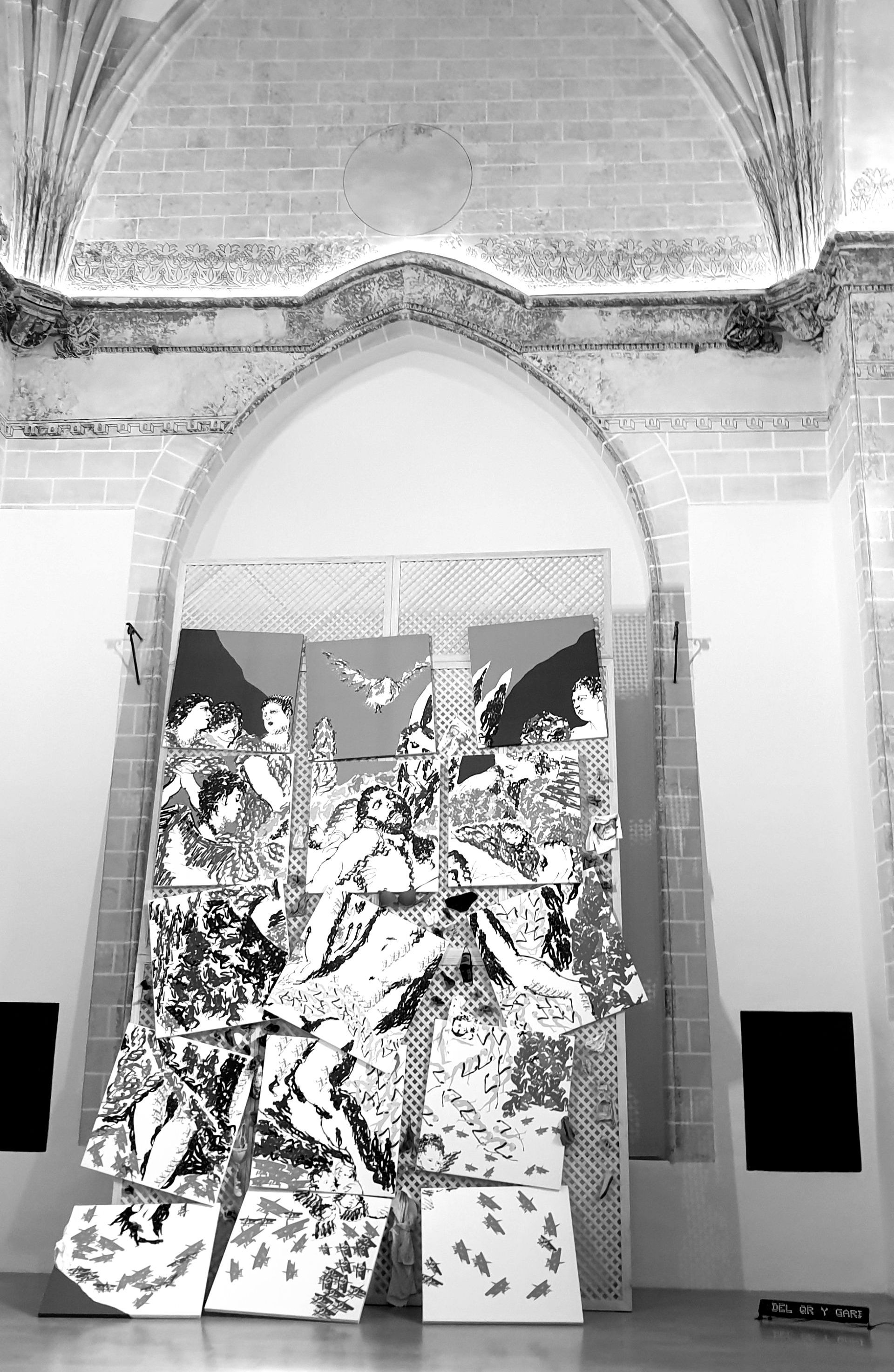 a black and white photo of a sculpture in a church.