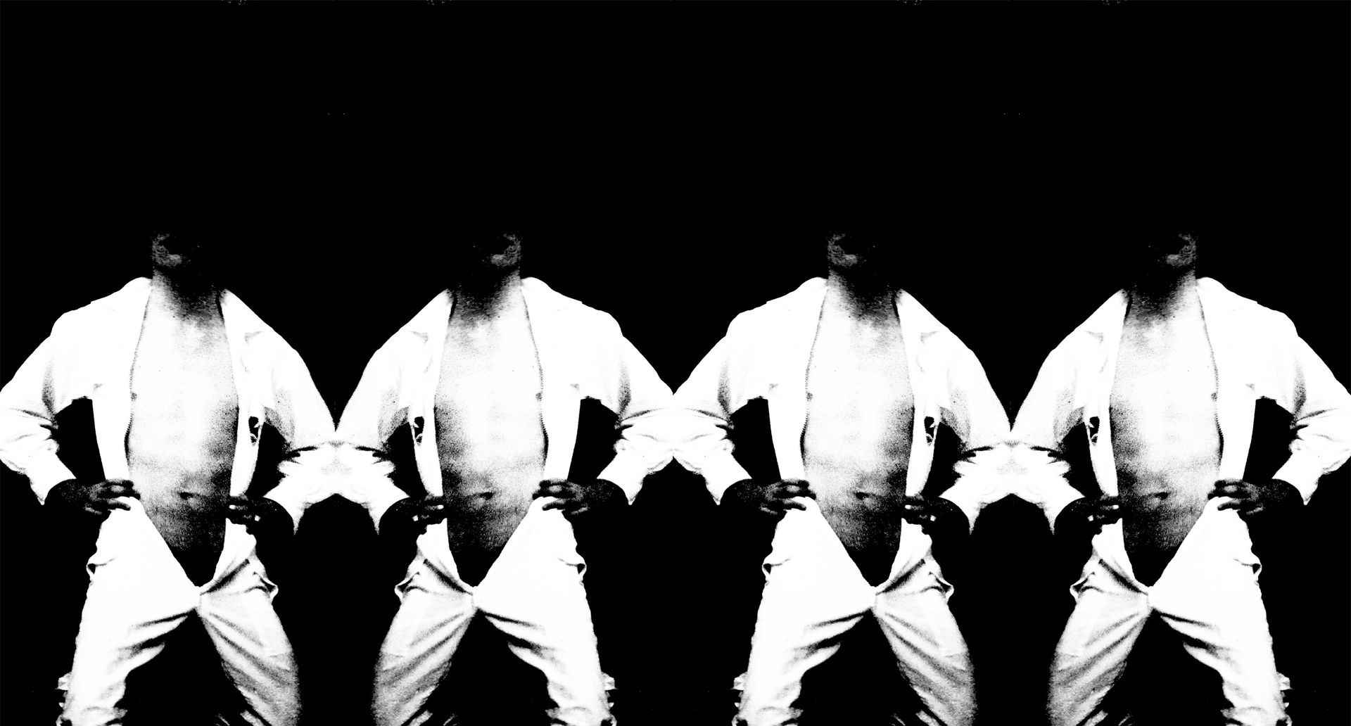 a group of men are standing in a row with their hands on their hips .