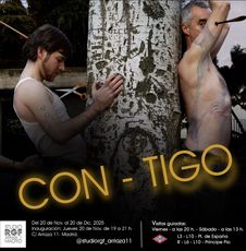 Two men leaning against tree, one with scissors, text: 