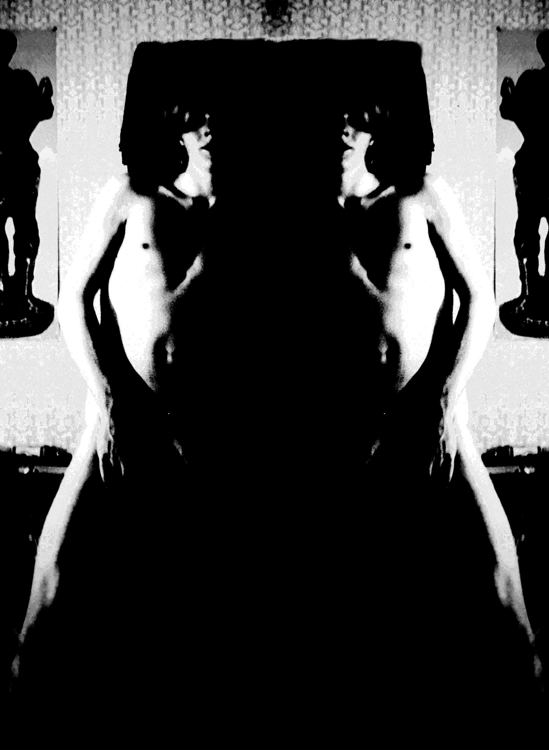 a black and white photo of two people standing next to each other