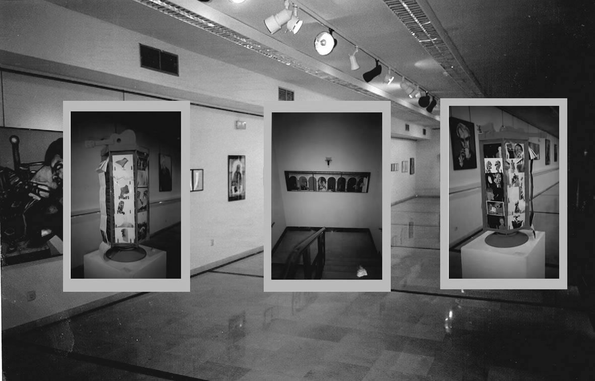 Gallery with exhibits in frames; the central exhibit is a display case.