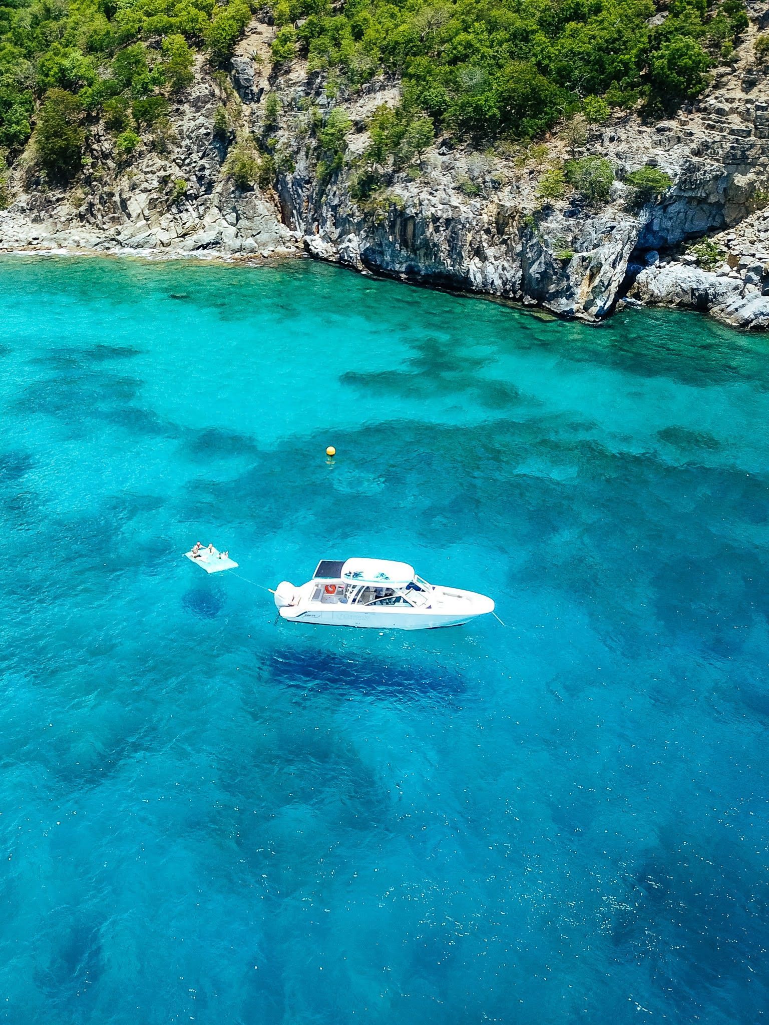 An aerial view of a boat in the ocean