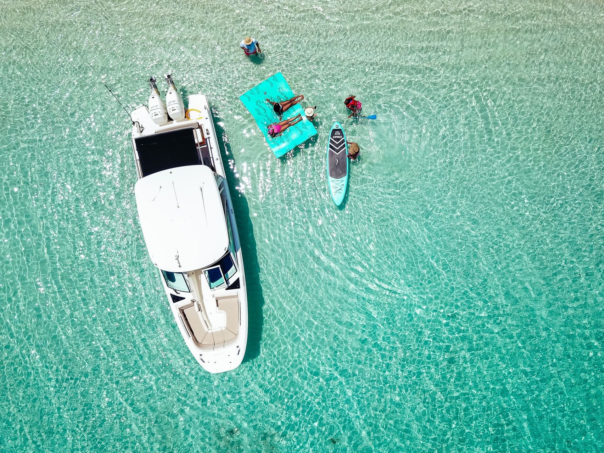 An aerial view of a boat floating on top of a body of water.