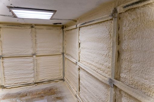 A large room with spray foam insulation covering it