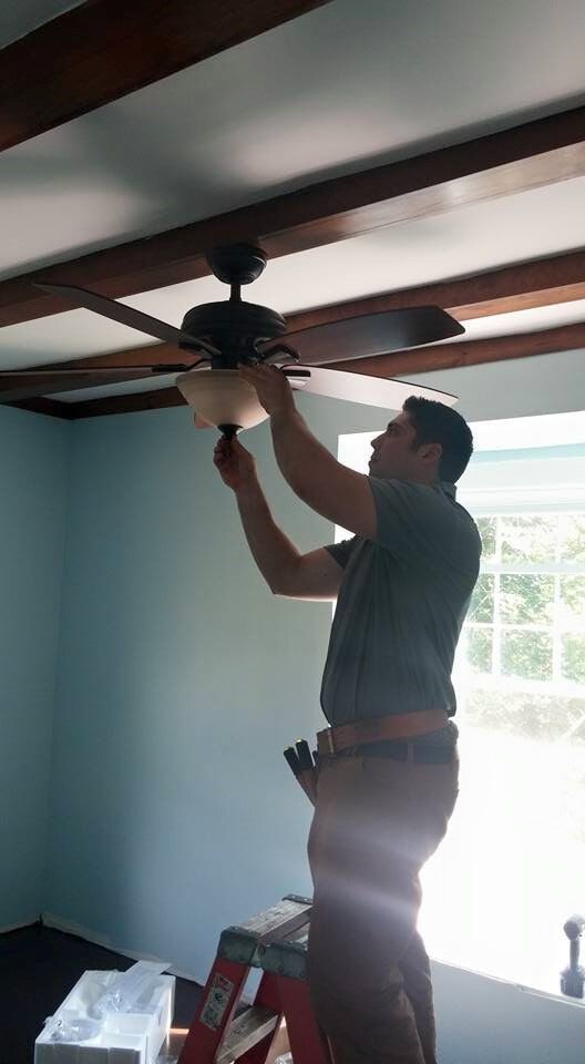 Man fixing ceiling fan 2— New Construction in Beaver, PA