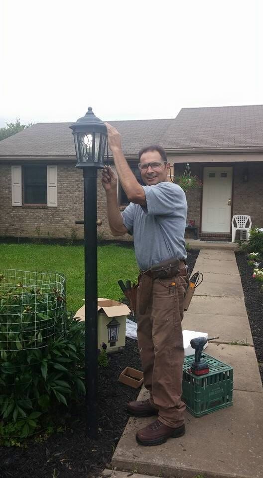 man fixing street lights — New Construction in Beaver, PA
