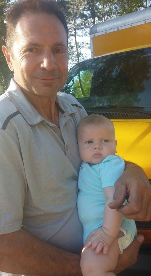 Daddy holding a baby — New Construction in Beaver, PA