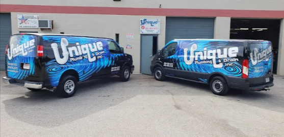 Plumbing services in Copley by Unique Plumbing & Drain, Inc., with branded service vans ready for re