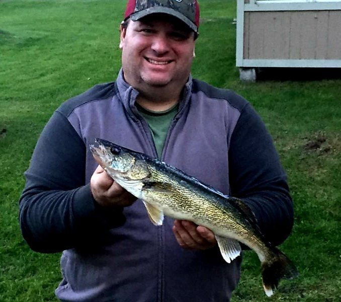 man-showing-caught-fish