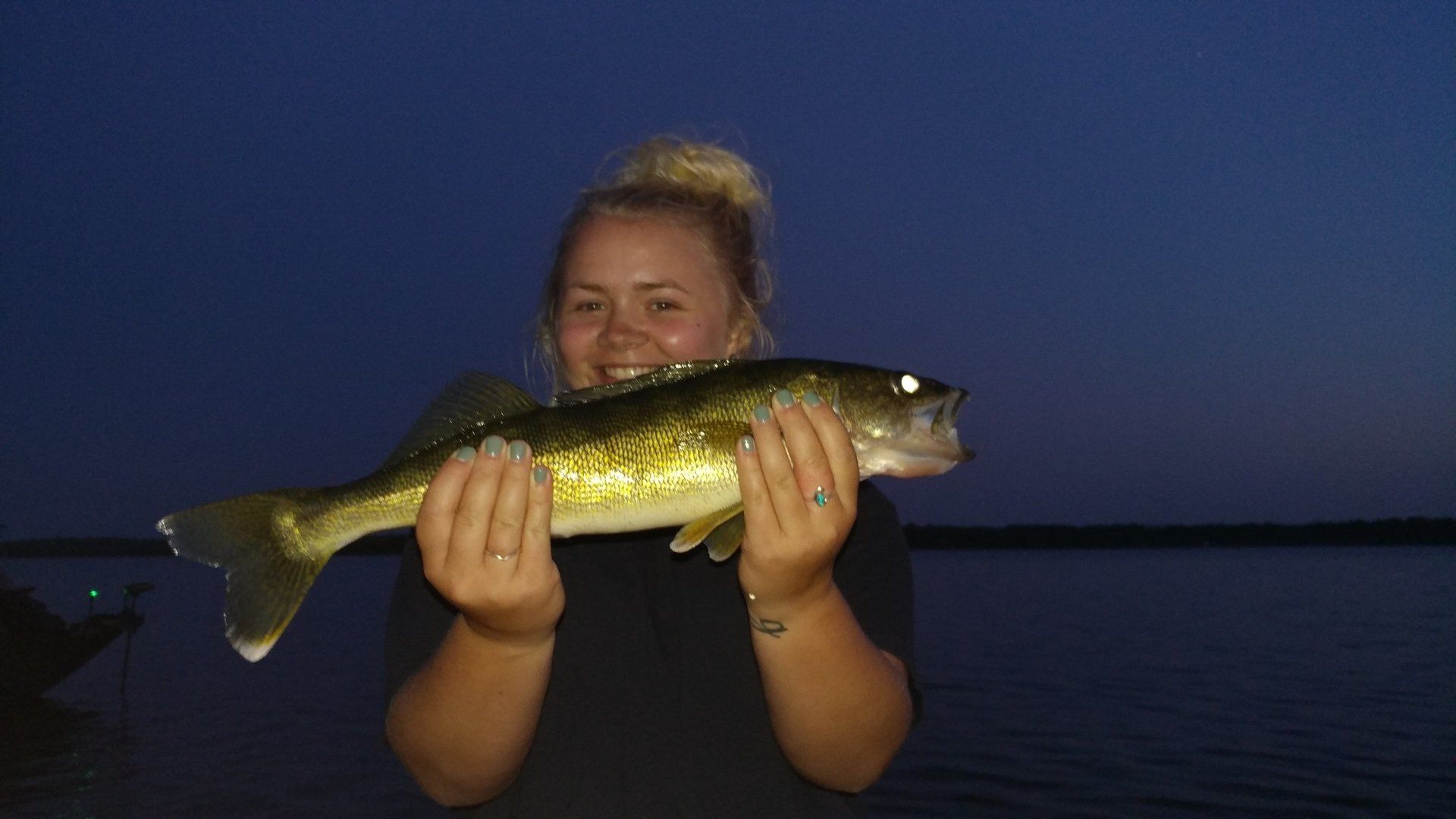 girl-showing-caught-fish