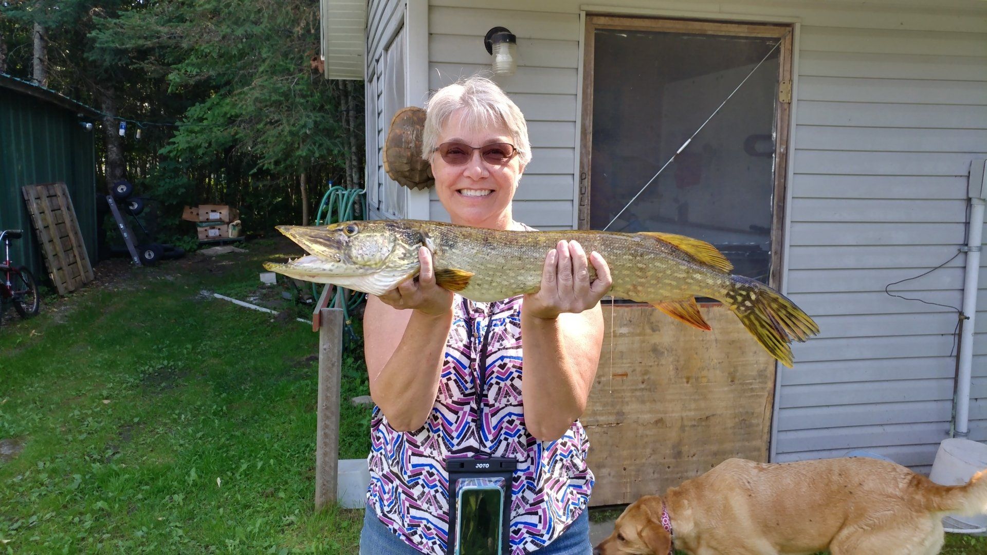 woman-showing-caught-fish