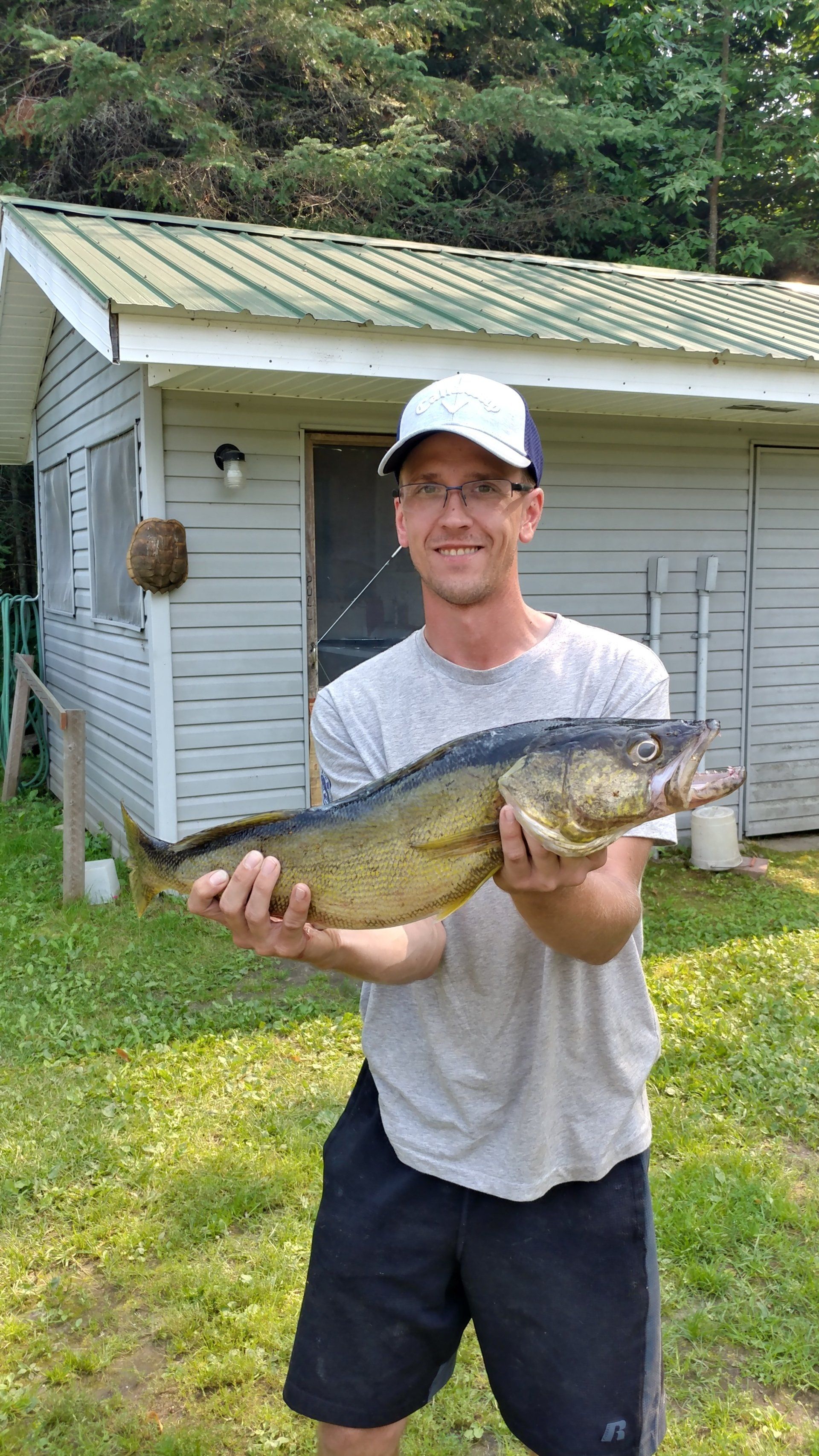 man-showing-caught-fish
