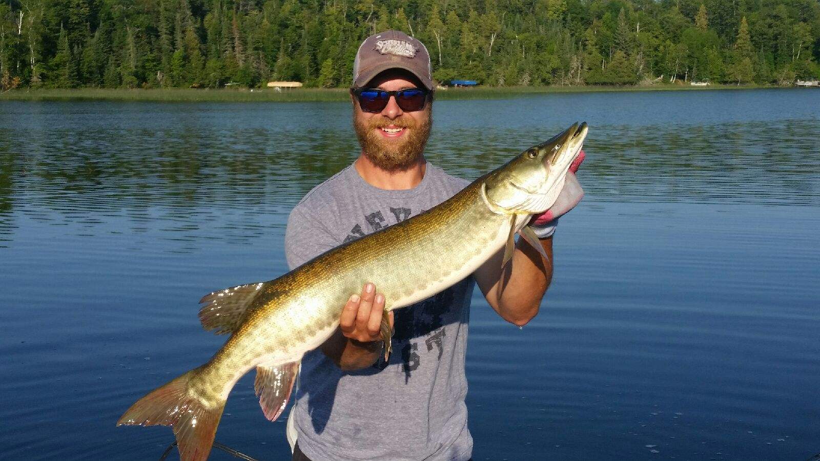 man-showing-caught-fish