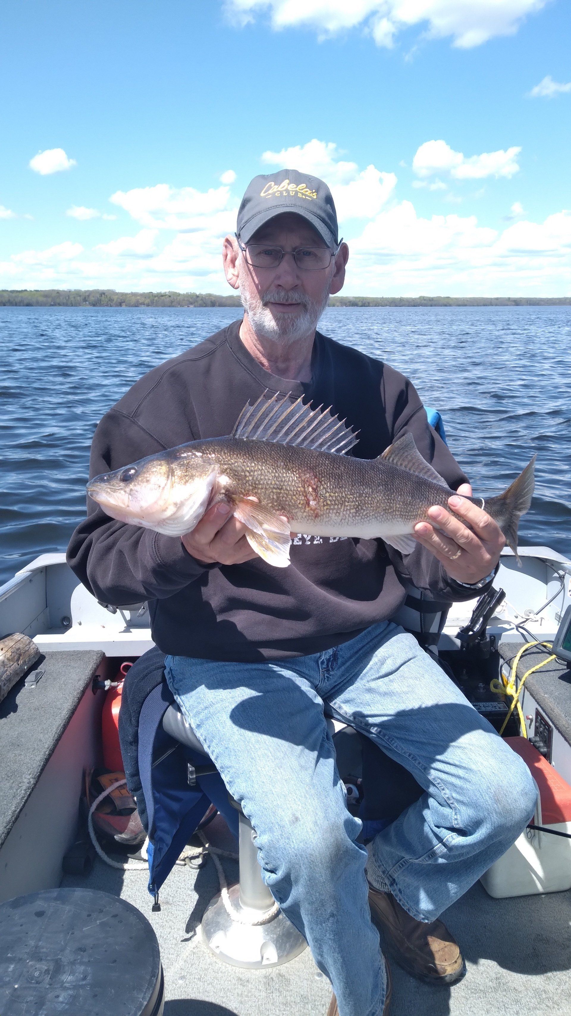 man-showing-caught-fish