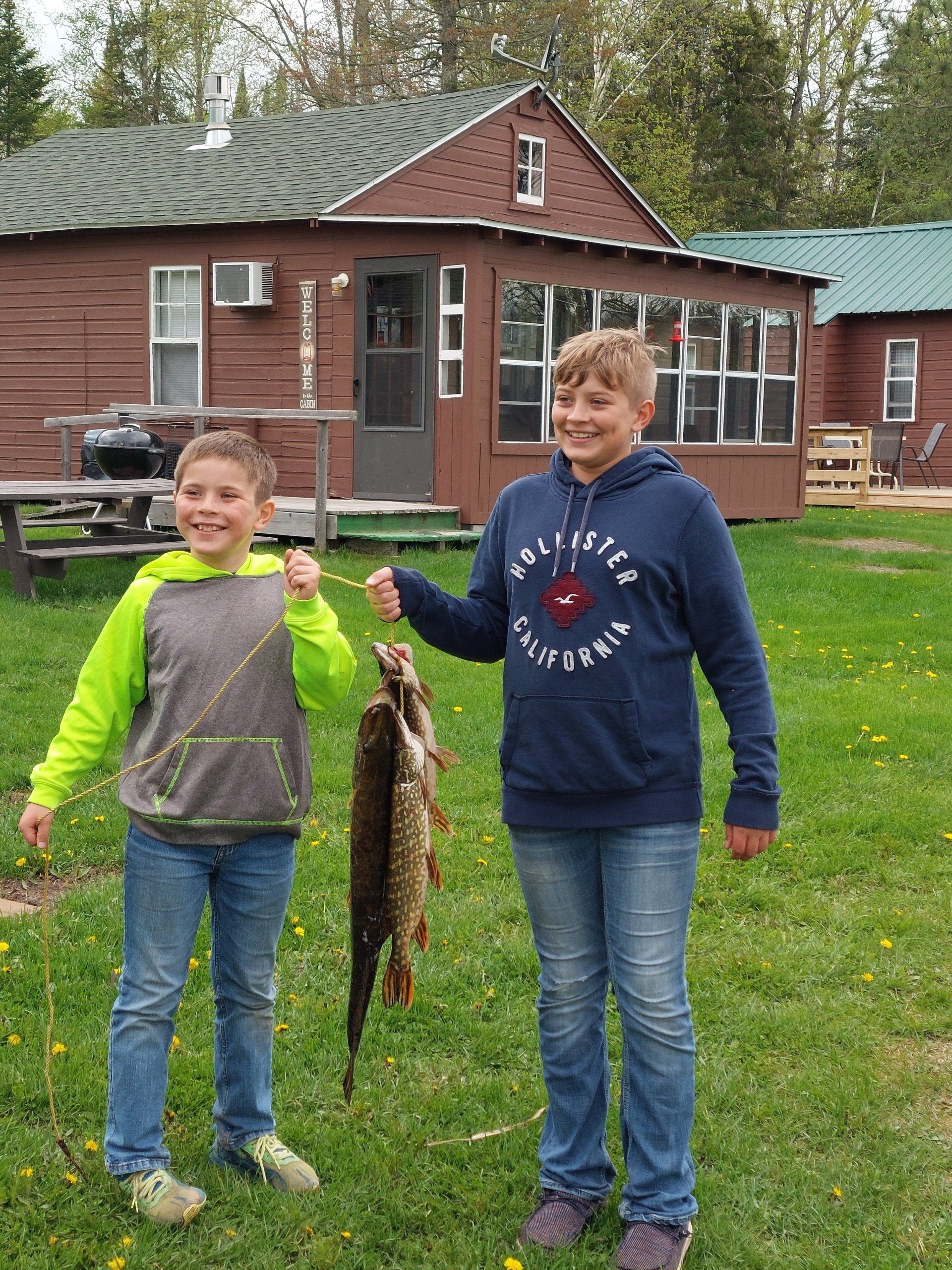 kids-showing-caught-fish