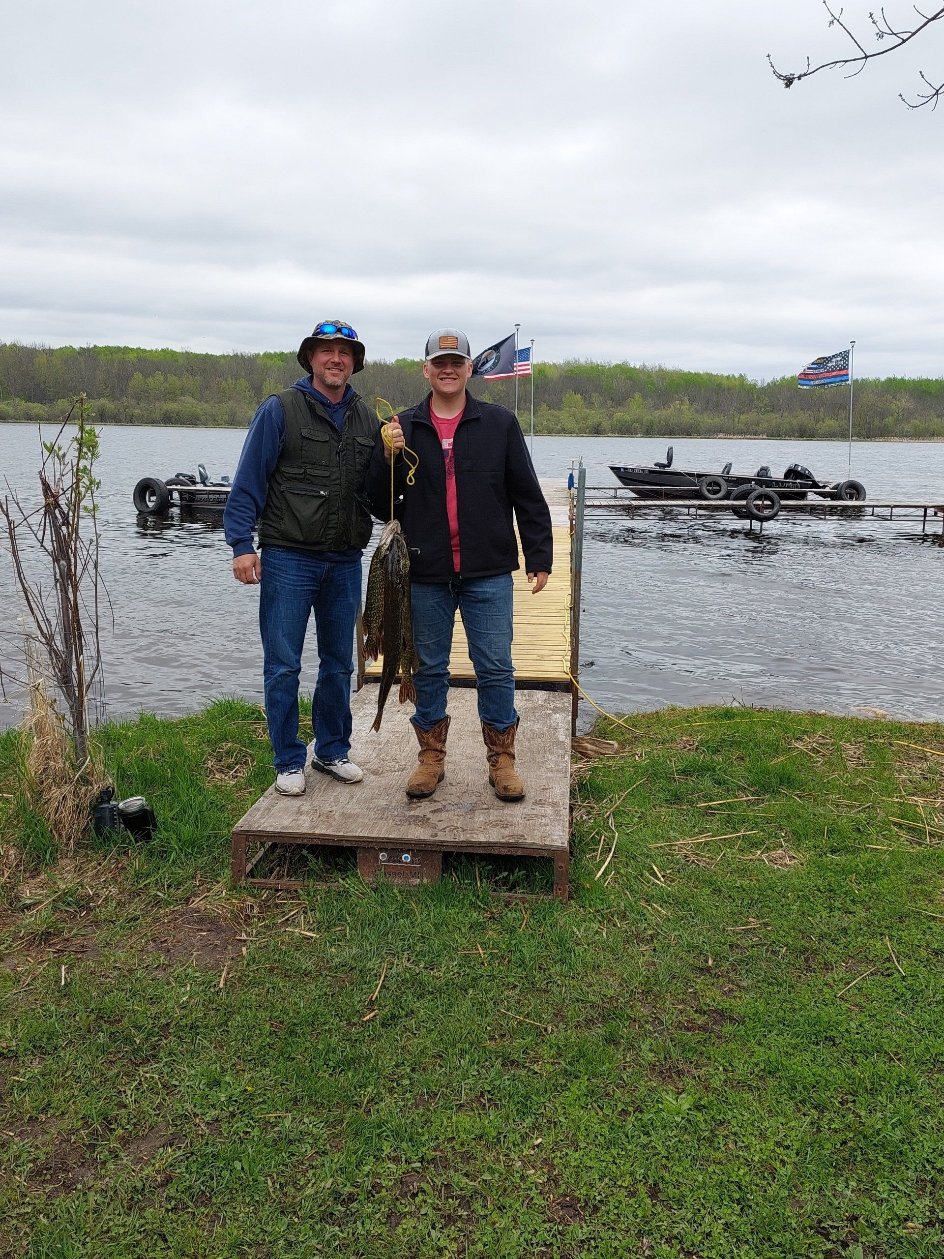 men-showing-caught-fish