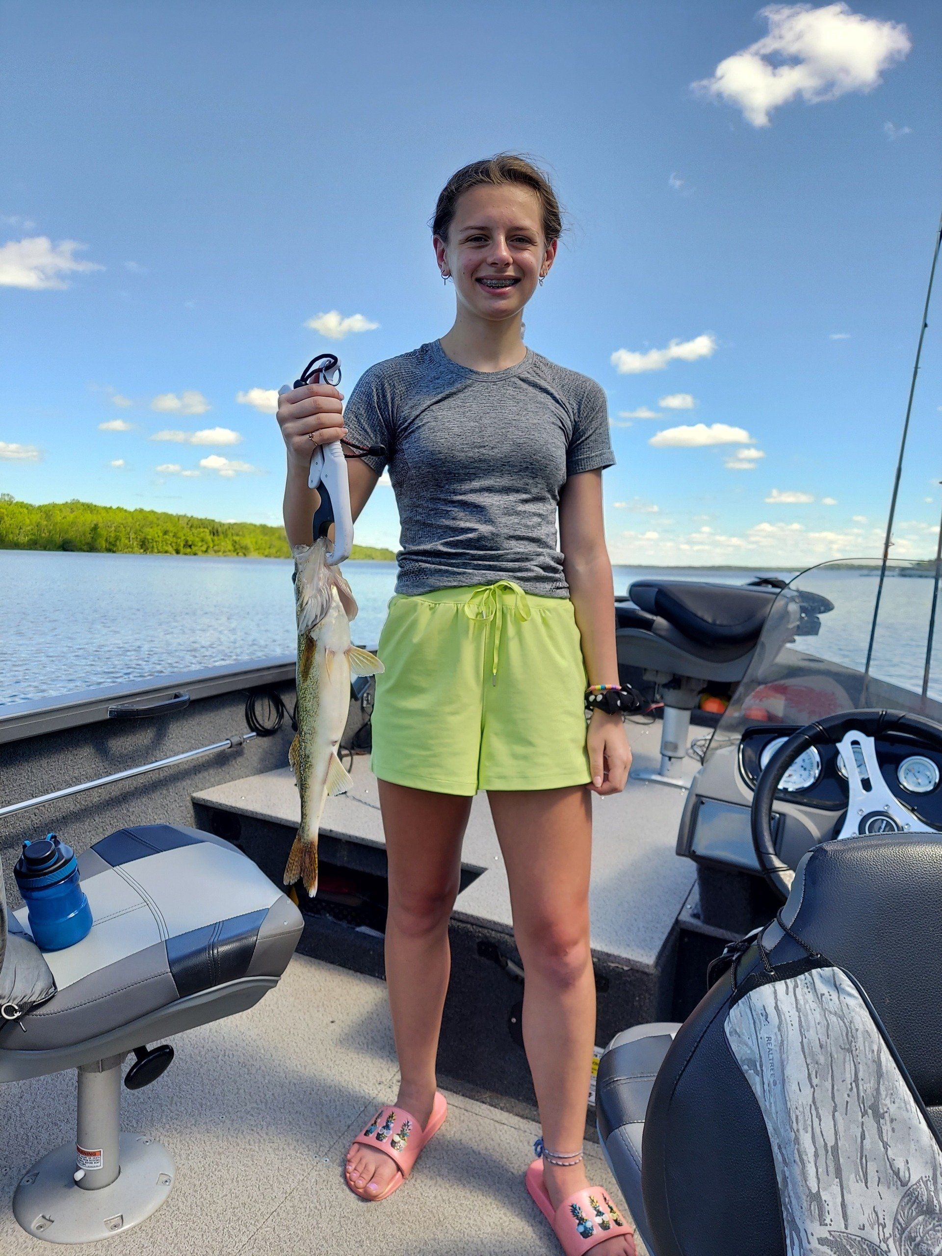 girl-showing-caught-fish