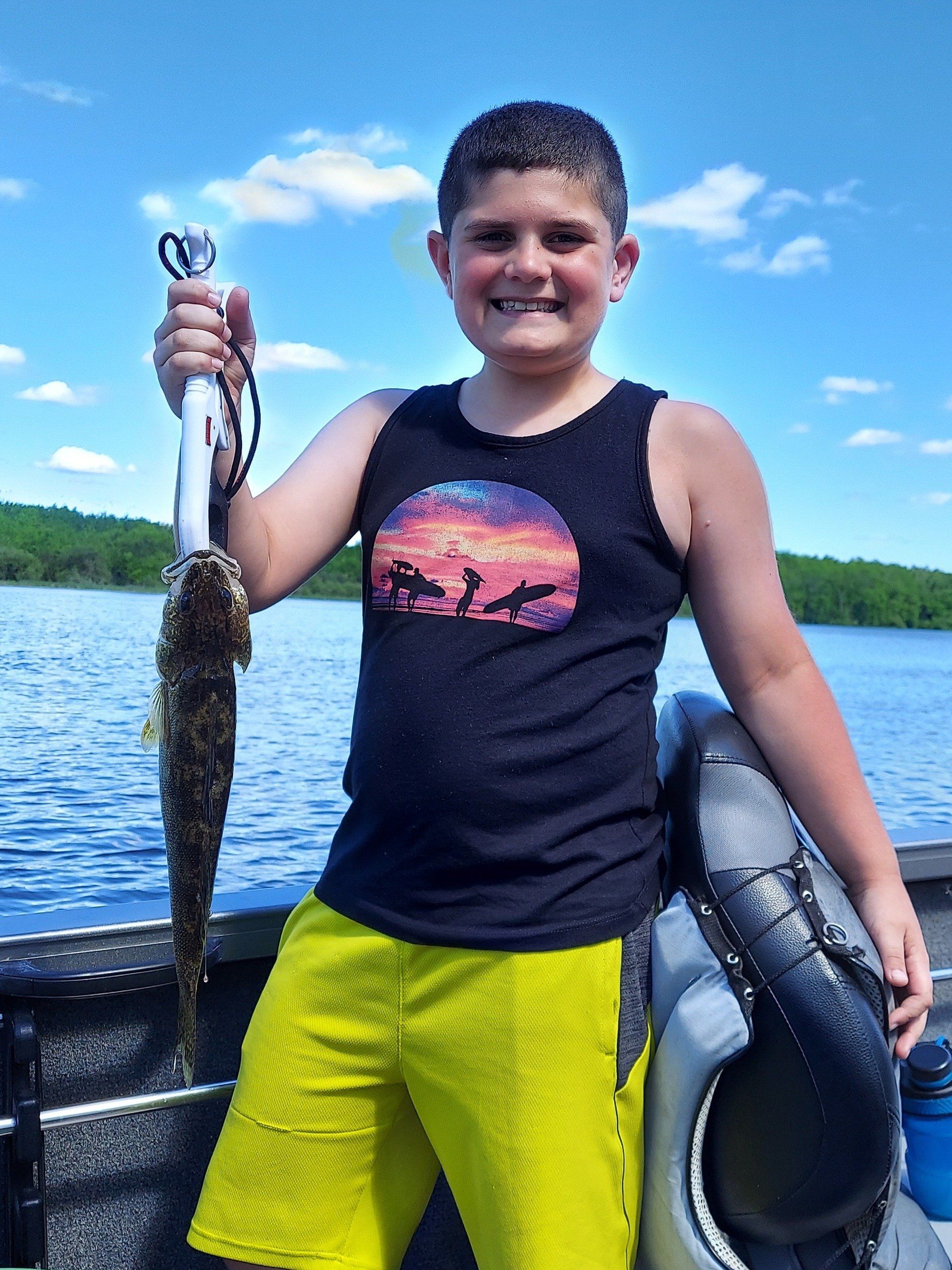 boy-showing-caught-fish