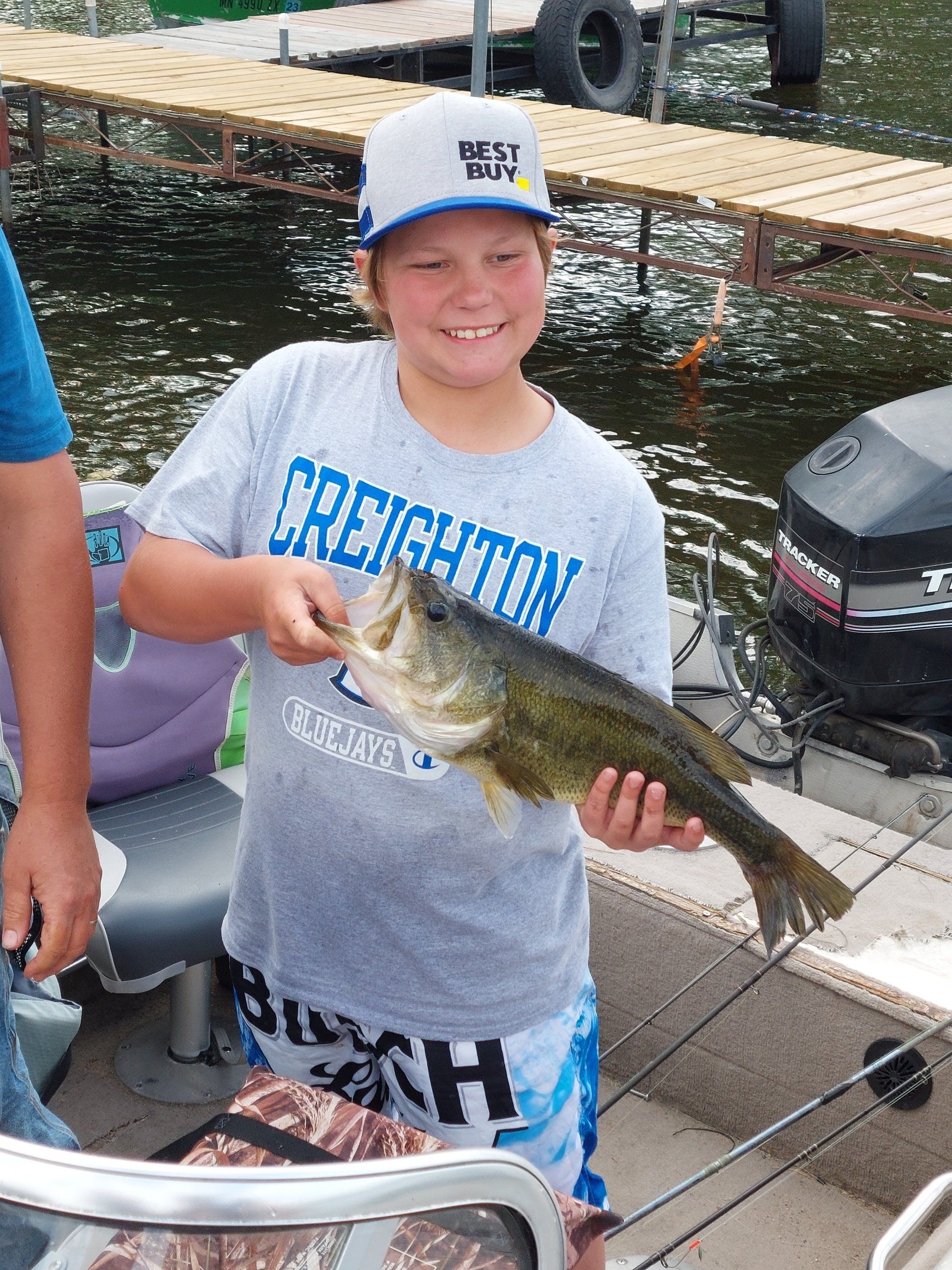 boy-showing-caught-fish