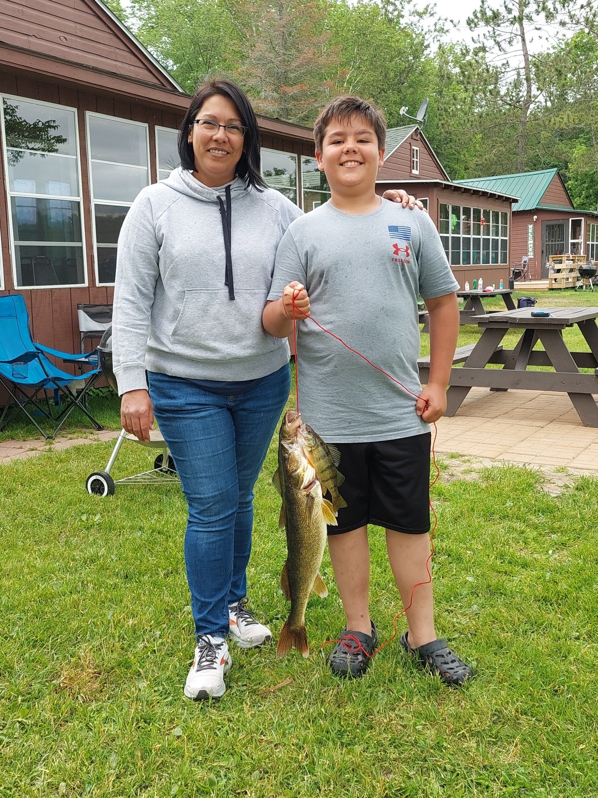boy-showing-caught-fish