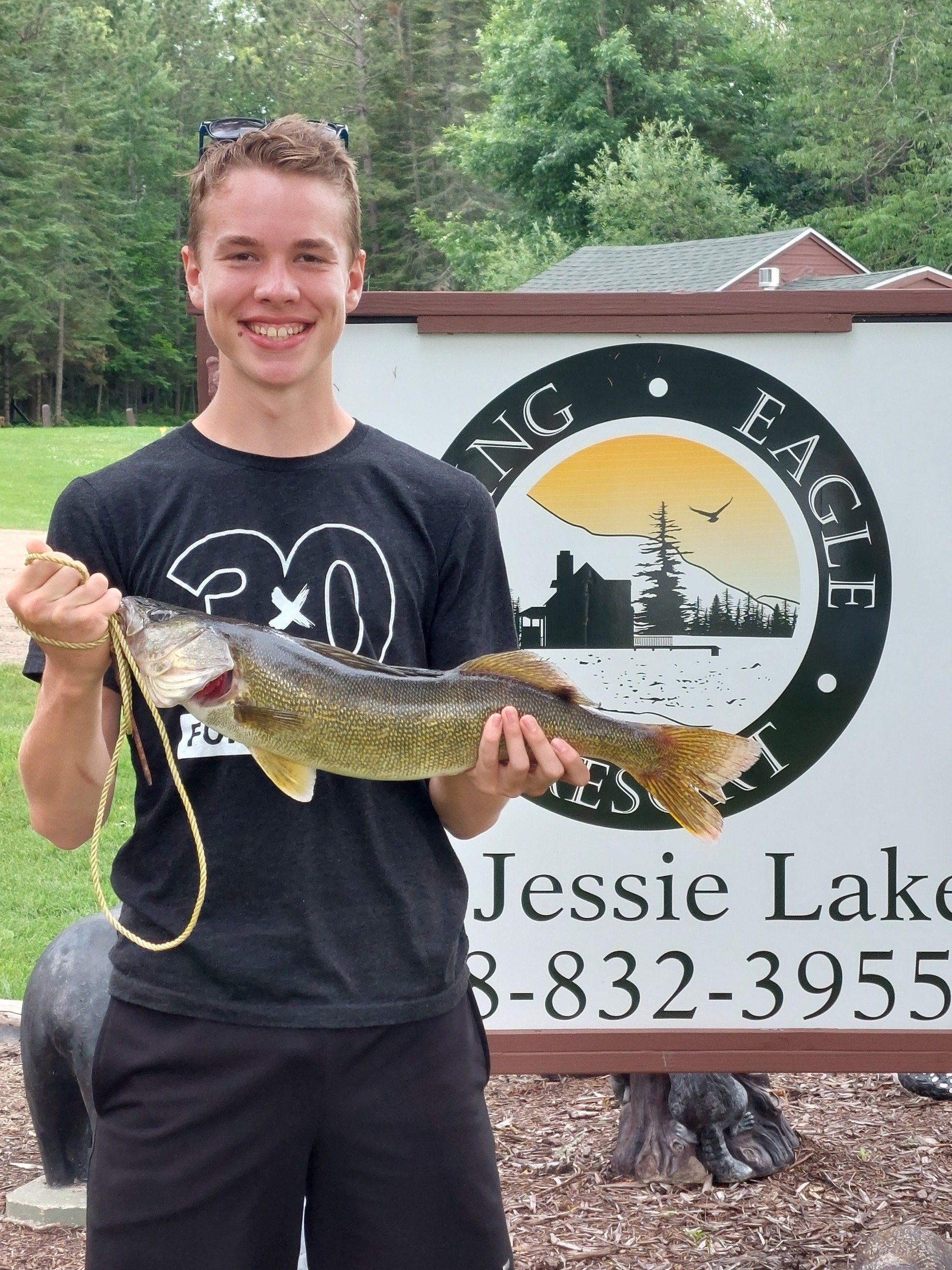 man-showing-caught-fish