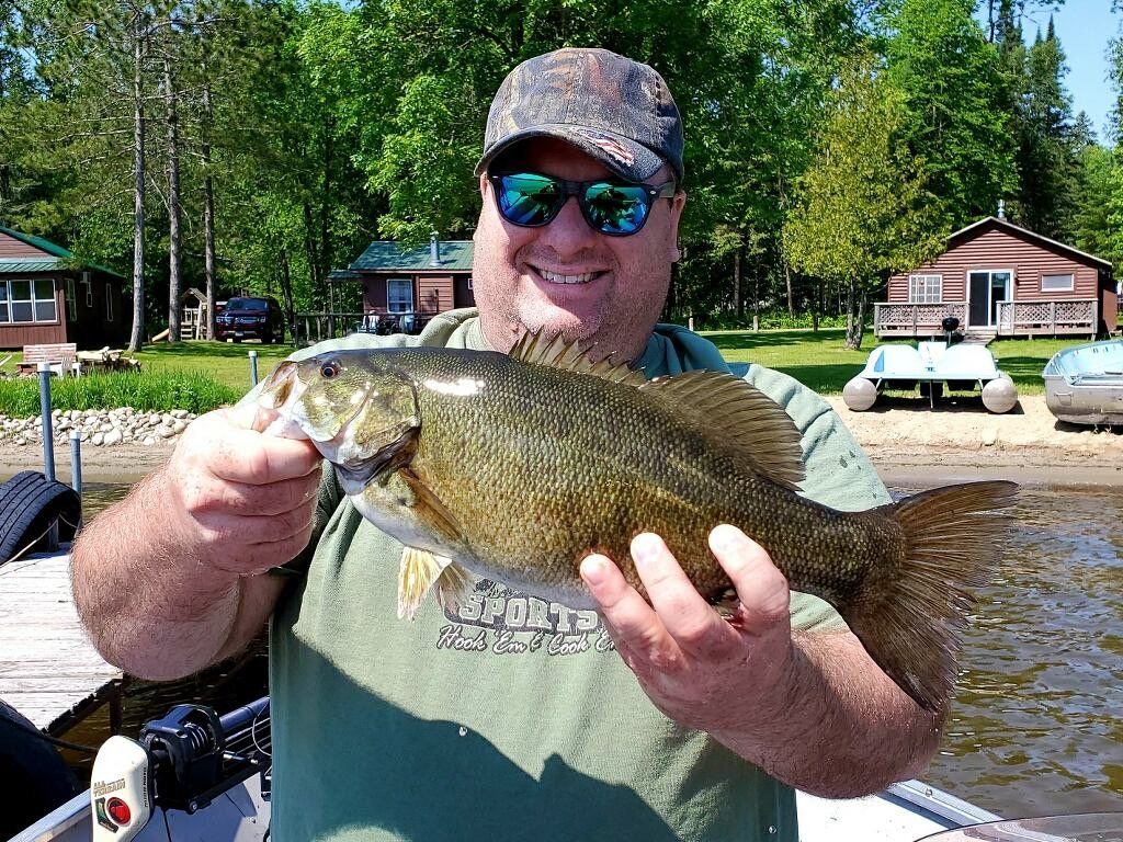 man-showing-caught-fish